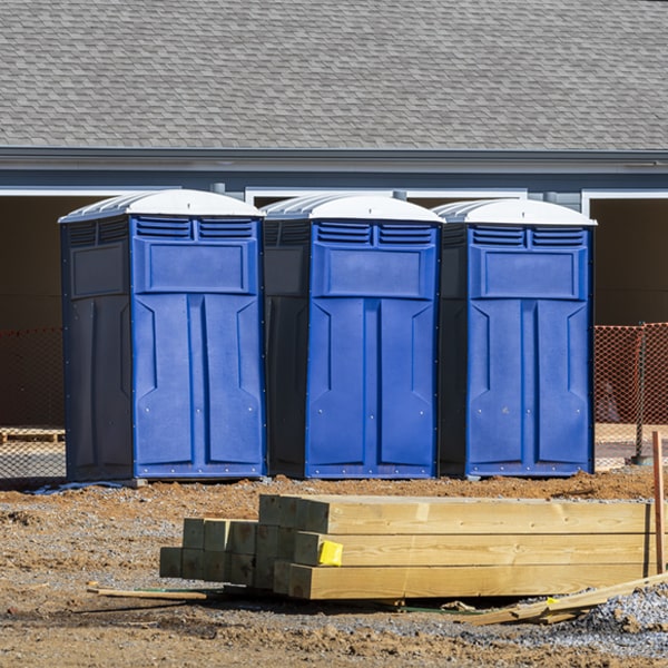 what is the cost difference between standard and deluxe portable restroom rentals in Dodson